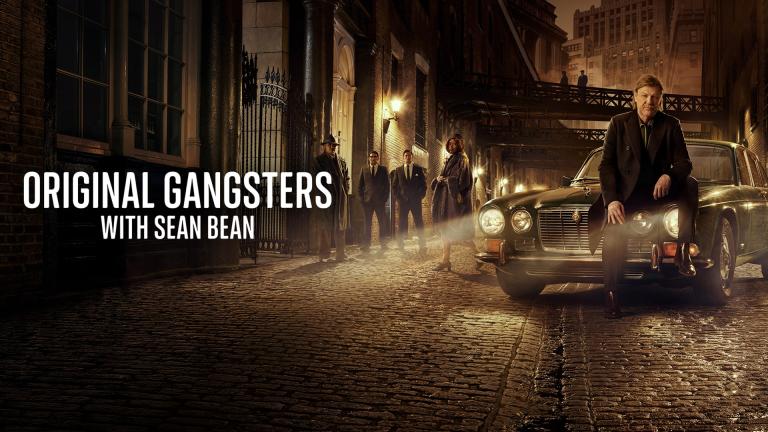 Sean Bean sits on a classic car in a dimly lit street beside retro gangsters and the text 'Original Gangsters with Sean Bean.'