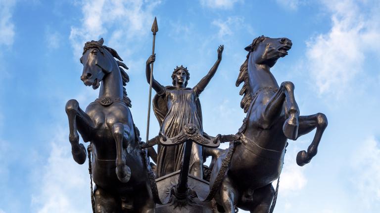 Statue of Boudica on her chariot with two horses rearing on their hind legs