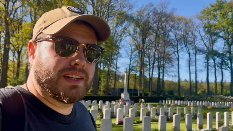 The author, Kyle Jackson, in front of war graves